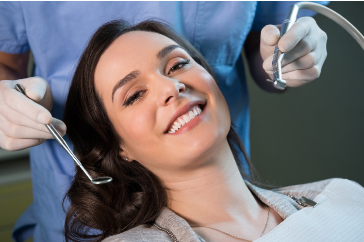 woman at a dental appointment to get amalgam fillings removed