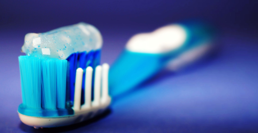Toothbrush loaded with fluoride enhanced toothpaste.